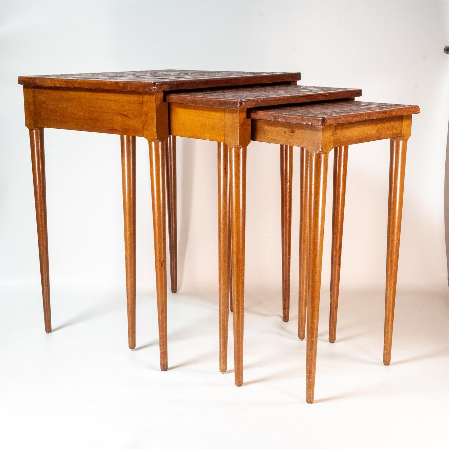 Late 20th Century Leather Wrapped Hand Tooled Peruvian Accent Nesting Tables - Set of 3