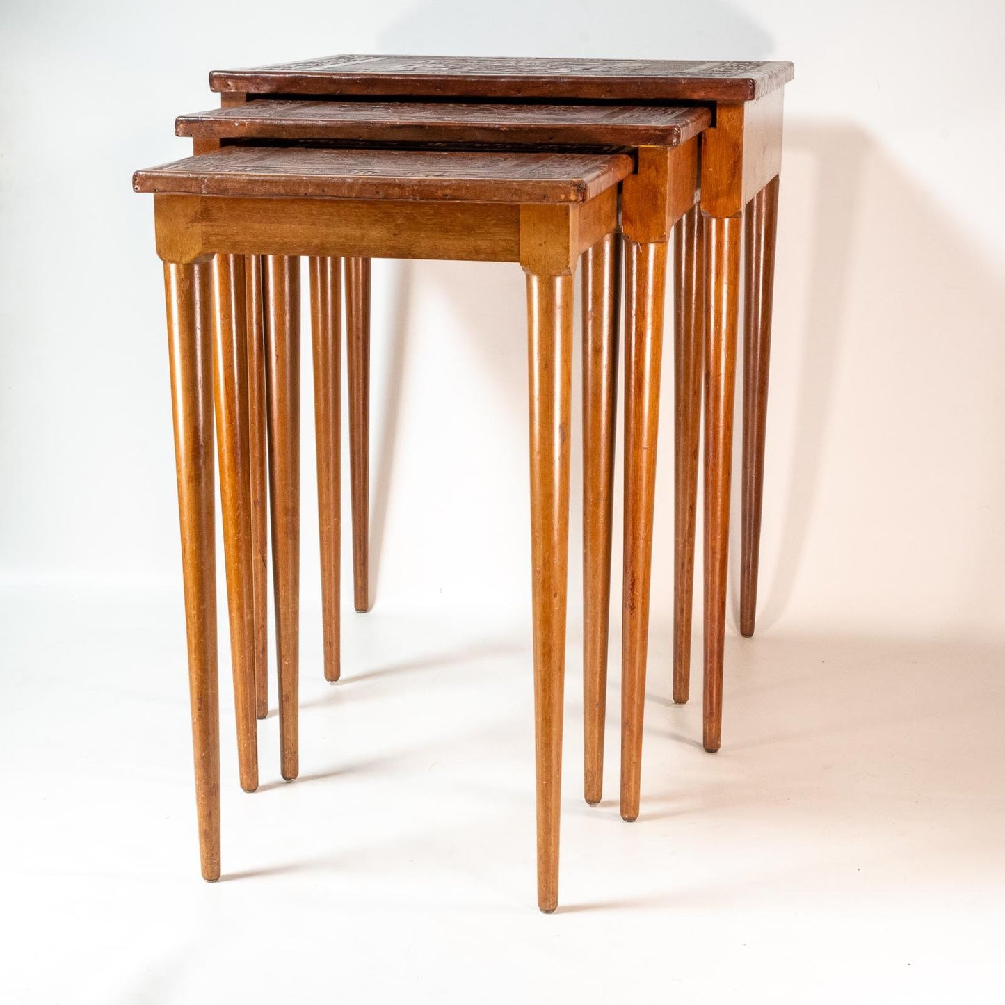 Late 20th Century Leather Wrapped Hand Tooled Peruvian Accent Nesting Tables - Set of 3