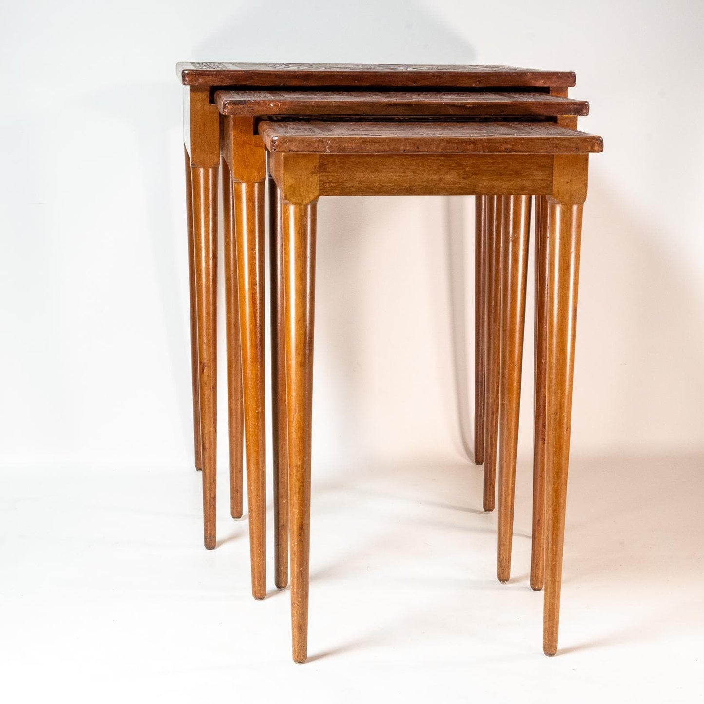 Late 20th Century Leather Wrapped Hand Tooled Peruvian Accent Nesting Tables - Set of 3